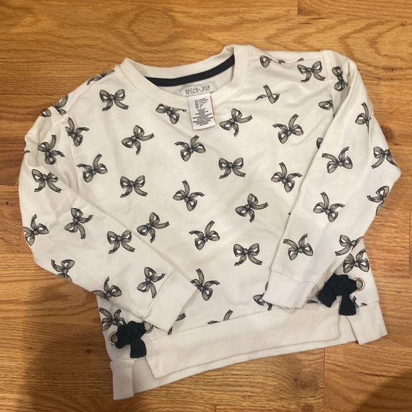 White Dress with Black Bow Print
4/$25 - Bundle & Save!!! - Picture 3 of 4